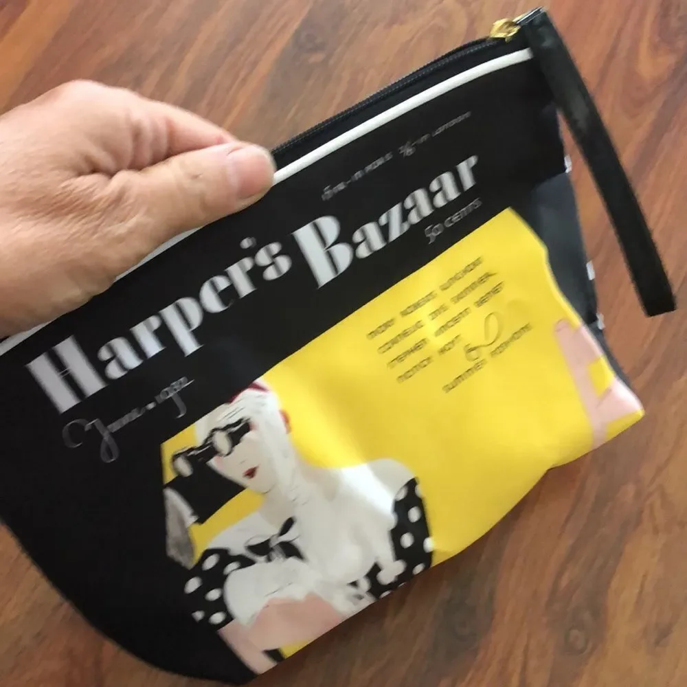 Estee Lauder Harpers Bizarre black and yellow cosmetic case.